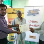 Contractor (middle) receiving Neev Abhiyan training completion certificate from Ambuja Cement’s team member (left) and a dealer (right)
