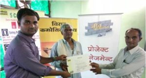Contractor (middle) receiving Neev Abhiyan training completion certificate from Ambuja Cement's team member (left) and a dealer (right)
