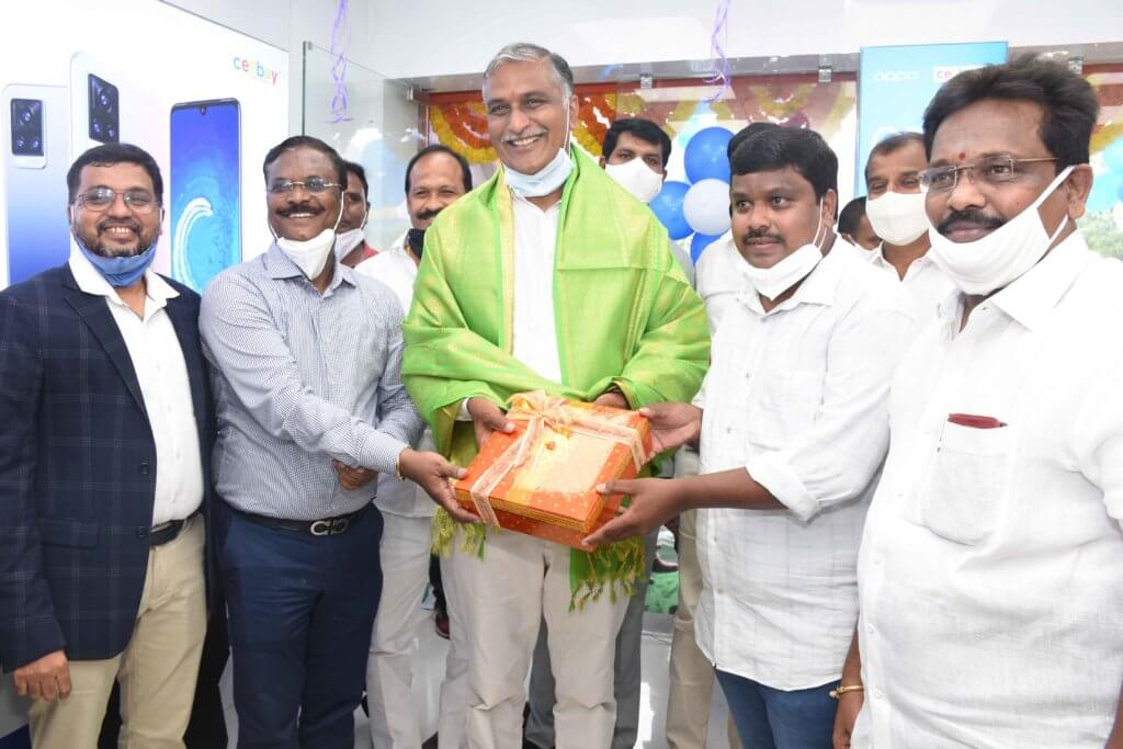 Siddipet, 22nd October, 2020 : Telangana Born, The fastest growing Multi Brand Mobile Retail chain “CellBay” – Which is also the Most Loved Multi-brand Mobile Store Brand of Telangana inaugurated its 56th Store at Siddipet, Telangana. The Grand Event witnessed the presence of Hon’ble Finance Minister of Telangana Shri. T.Harish Rao Garu Unveiling the Hi-End 56th Store of Cell Bay at Siddipet. Honourable Minister expressed his happiness and appreciated Cellbay Management, seeing the way The Telangana based Organization is growing, providing best Products & Services and giving Employment to many across the state. On this auspicious occasion, Cellbay MD Shri Soma Nagaraju garu expressed his happiness saying that, ‘We are very happy and fortunate to inaugurate our 56th Cellbay Showroom in Siddipet, that too by our Honourable Minister. We at Cellbay always offers best prices, best experience and best after sales service to our customers. He added that, Cellbay is offering many attractive inaugural offers like laptop bag, Bluetooth headsets, Cash Back Offers, EMI option on any Rs.3000/- and above purchases, 0% finance Options, and many more attractive scratch n win gifts. He further added that, Cellbay’s vision is to Become the ‘The Most Trusted Brand in Multi Brand Mobile Retail Chain Stores’. We have a concrete expansion plan to open 100 stores by end of this financial year to serve the entire Telengana customers. Mr. Nagaragu conveyed his advance Dussehra and Diwali wishes to all Consumers and said that, Cellbay is selling Smart TV’s of MI, ONE PLUS, ITEL, TCL, Smart Water Purifiers, Mobile & Fashion Accessories along with Mobiles. Member of Parliament Shri Kotha Prabhakar Reddy garu graced the occasion as an honorary guest. Shri Ravindar Reddy Garu ( SUDA Chairman), Shri Raja Narsu Garu( Muncipal Chairman), Shri Sampath Reddy Garu( Town President) and Shri Komandla Srinivas Reddy Garu also attended and graced the occasion. Cellbay Director Shri Venkatesh Nallacheru garu and the other staff members participated in the inaugural function.